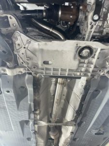 metal brace under exhaust tunnel